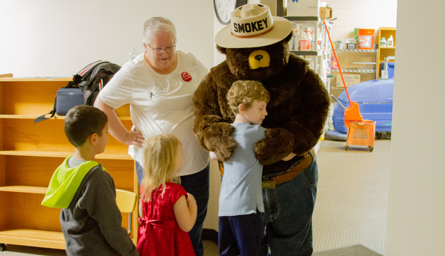 Smokey the Bear teaches Woodland Primary School students how to prevent forest fires