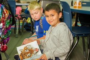 Book Buddies at Woodland Intermediate School work together to improve their reading skills