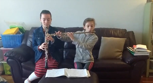 Grace and Abigail Heffernan continue learning at home by practicing their musical instruments