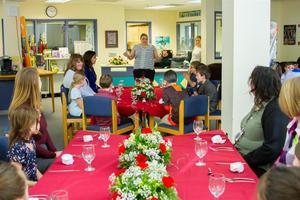 Students learn proper table etiquette and try new foods during the Fine Dining Event at Woodland Intermediate School